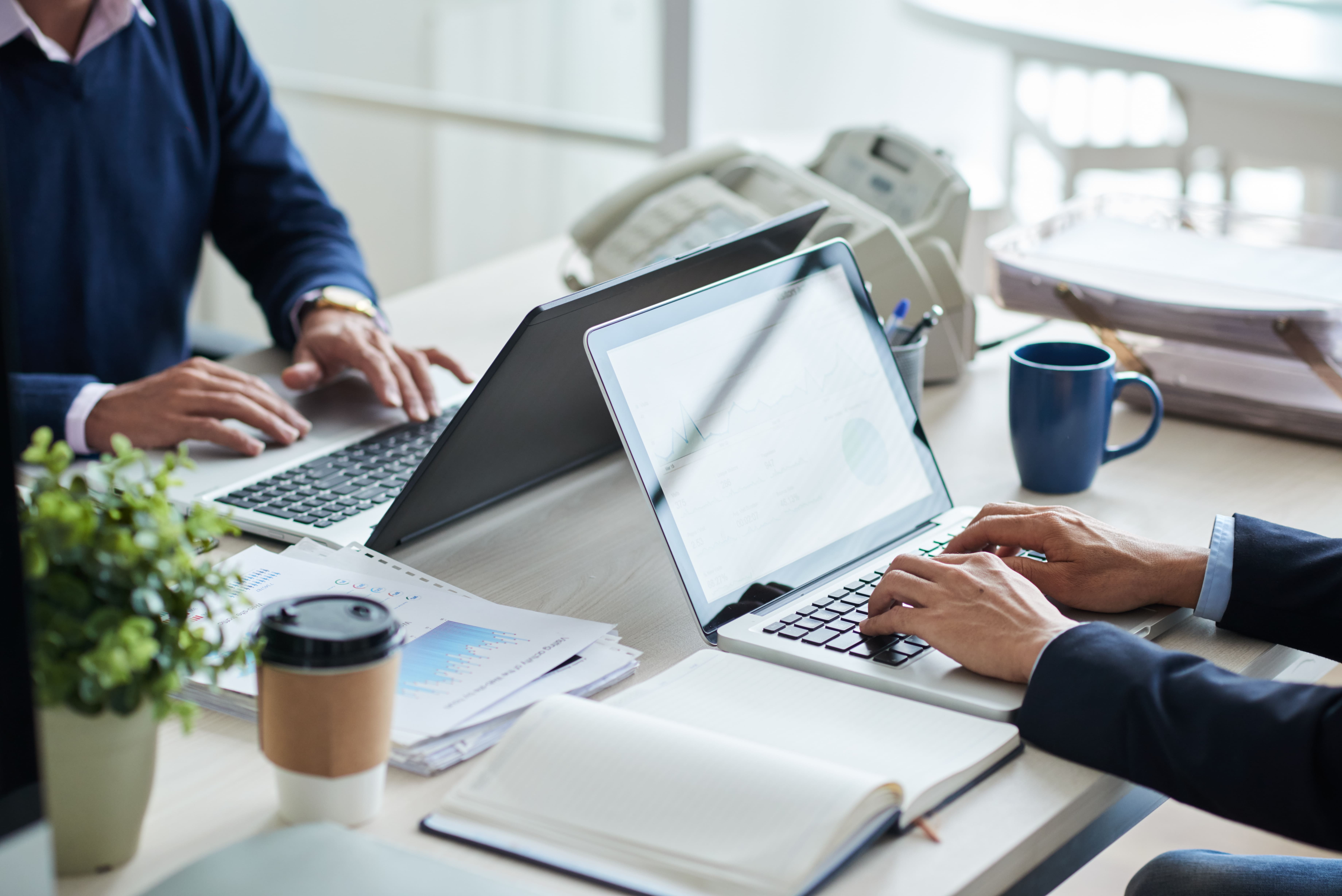 side-view-cropped-unrecognizable-business-people-working-common-desk side-view-cropped-unrecognizable-business-people-working-common-desk